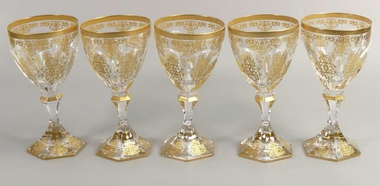 Lot 34 was a set of De Lamerie Fine Bone China heavily gilded glass crystal exotic garden patterned wine glasses that found a hammer price of £420.