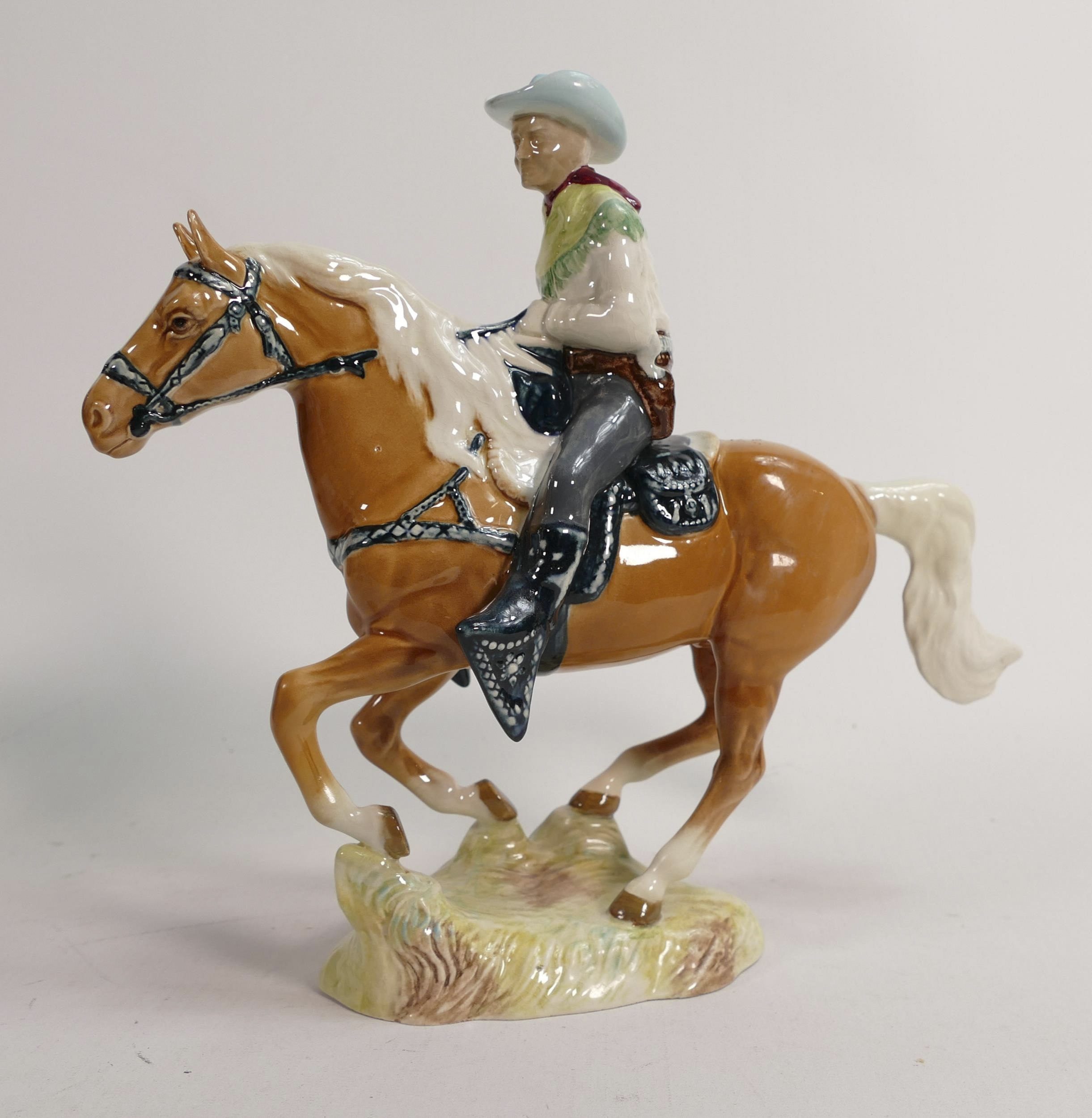 This charming Beswick Cowboy on a galloping palomino horse 1377 sold for £320.